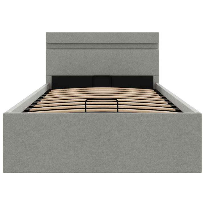 hydraulisk opbevaringsseng med LED 90x200 cm stof lysegrå
