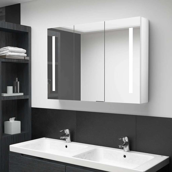 badeværelsesskab med spejl + LED-lys 89x14x62 cm skinnende hvid