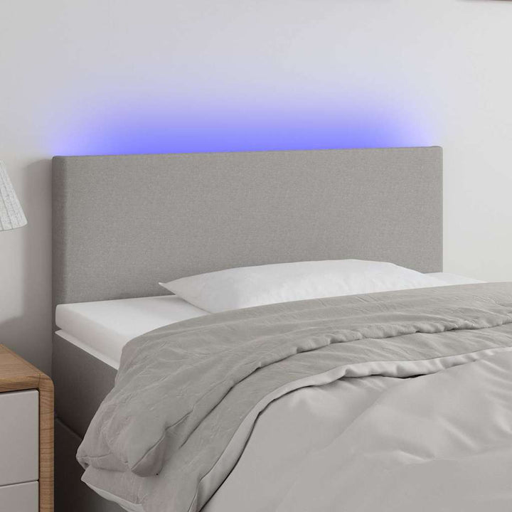sengegavl med LED-lys 80x5x78/88 cm stof lysegrå
