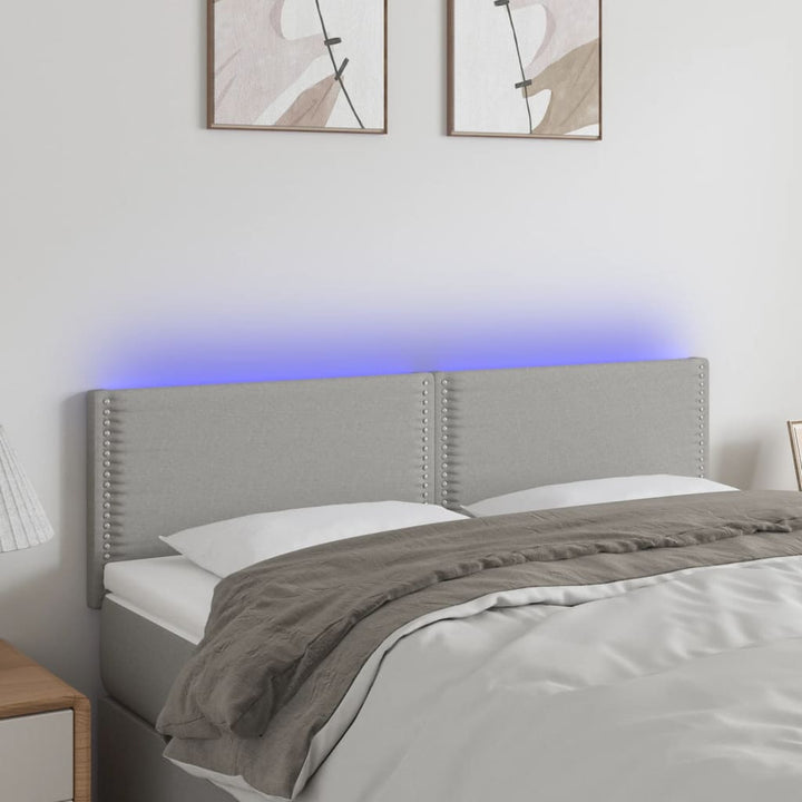 sengegavl med LED-lys 144x5x78/88 cm stof lysegrå