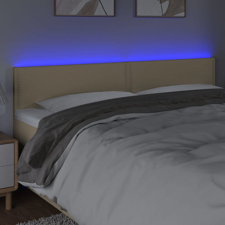sengegavl med LED-lys 180x5x78/88 cm stof cremefarvet