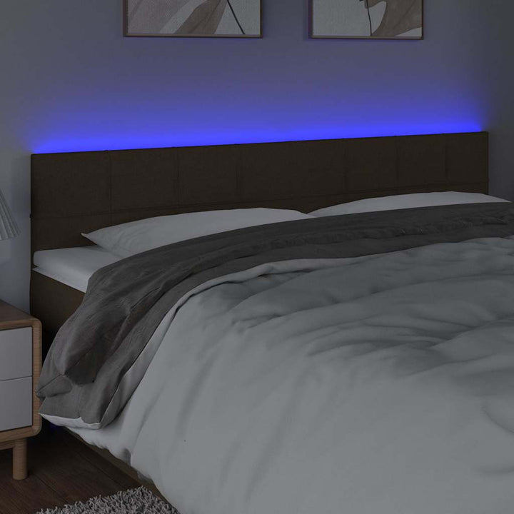 sengegavl med LED-lys 160x5x78/88 cm stof mørkebrun