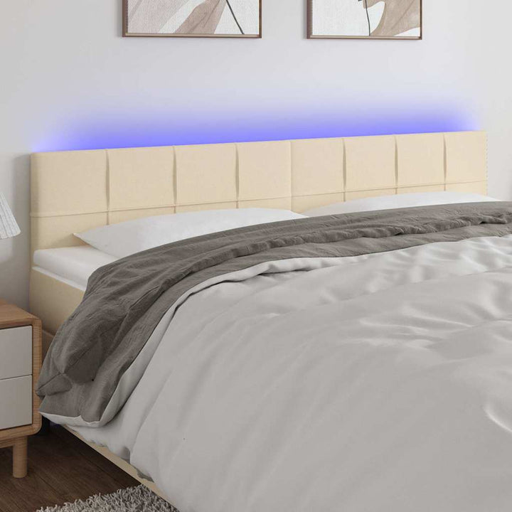sengegavl med LED-lys 200x5x78/88 cm stof cremefarvet