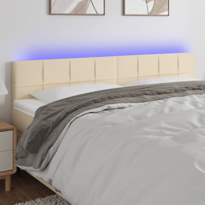 sengegavl med LED-lys 200x5x78/88 cm stof cremefarvet