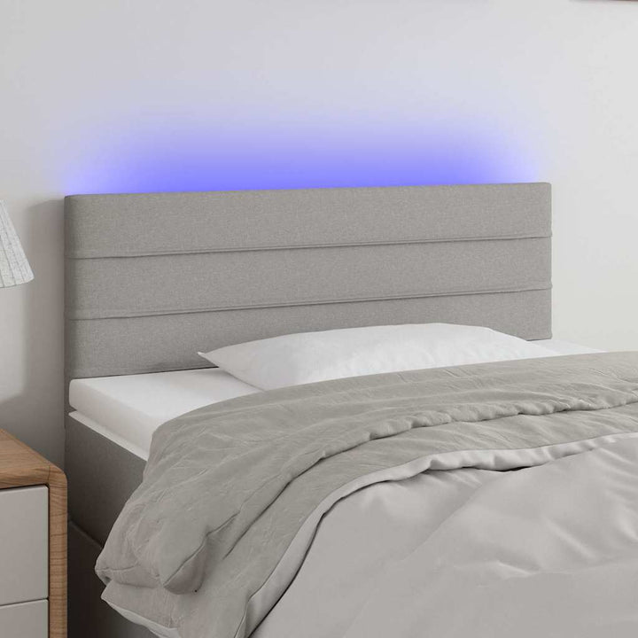 sengegavl med LED-lys 100x5x78/88 cm stof lysegrå