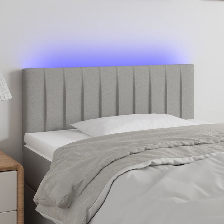 sengegavl med LED-lys 100x5x78/88 cm stof lysegrå