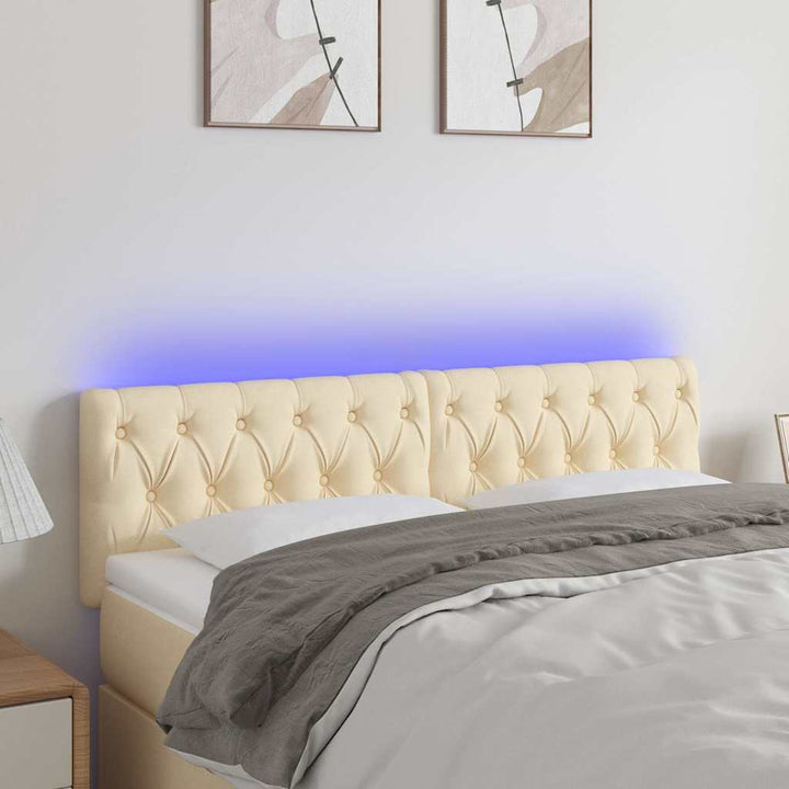sengegavl med LED-lys 144x7x78/88 cm stof cremefarvet