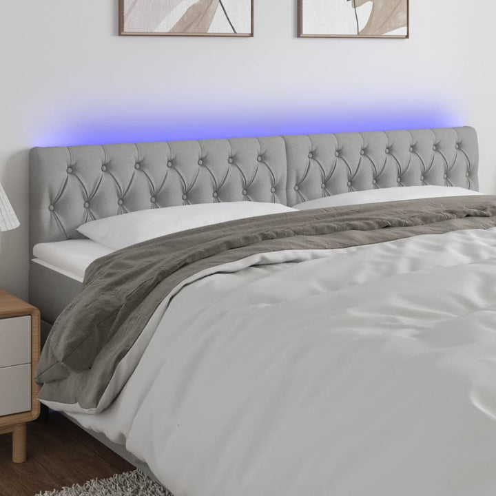 sengegavl med LED-lys 180x7x78/88 cm stof lysegrå