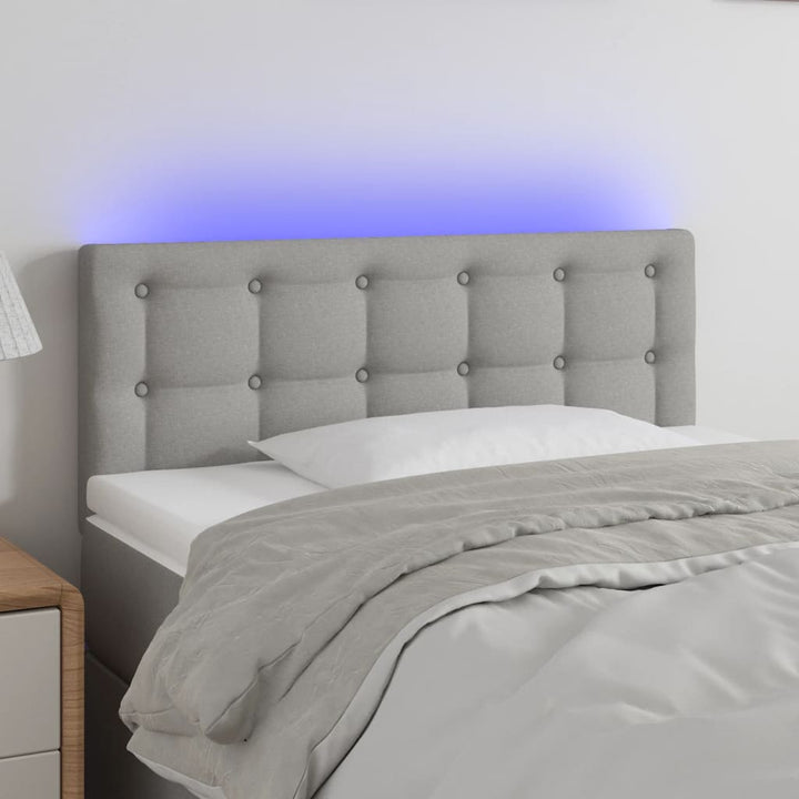 sengegavl med LED-lys 100x5x78/88 cm stof lysegrå