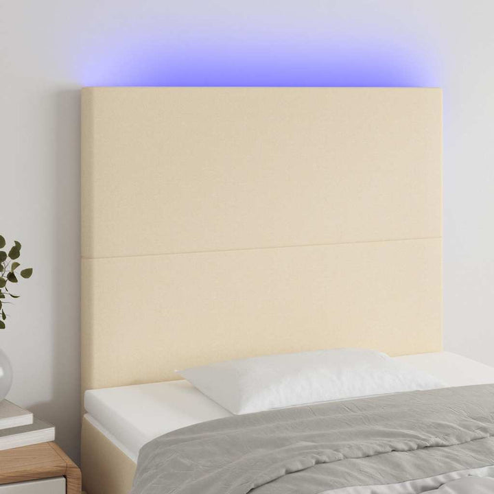 sengegavl med LED-lys 90x5x118/128 cm stof cremefarvet