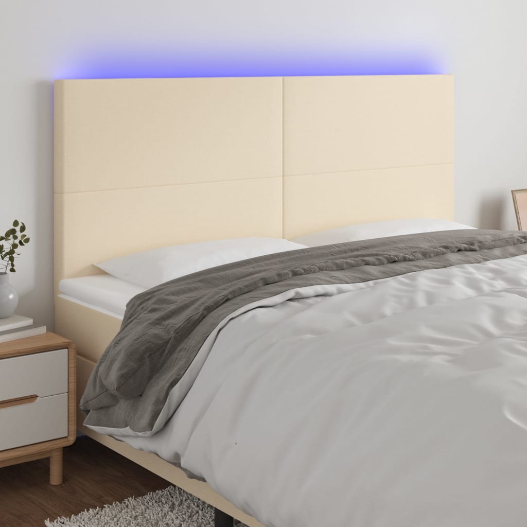 sengegavl med LED-lys 160x5x118/128 cm stof cremefarvet