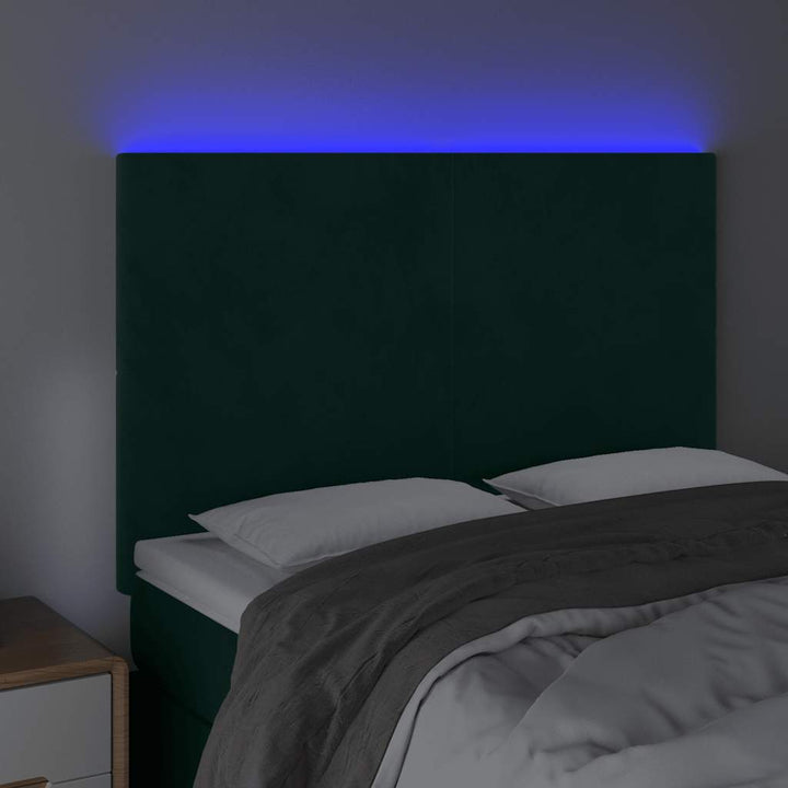 sengegavl med LED-lys 144x5x118/128 cm fløjl mørkegrøn