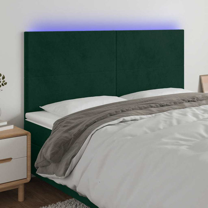 sengegavl med LED-lys 160x5x118/128 cm fløjl mørkegrøn