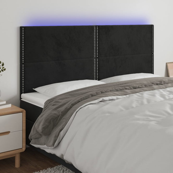 sengegavl med LED-lys 200x5x118/128 cm fløjl sort