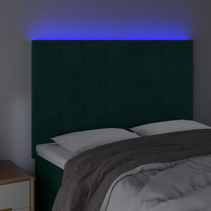 sengegavl med LED-lys 144x5x118/128 cm fløjl mørkegrøn
