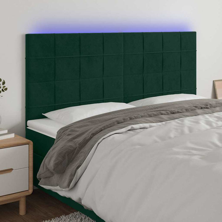 sengegavl med LED-lys 160x5x118/128 cm fløjl mørkegrøn