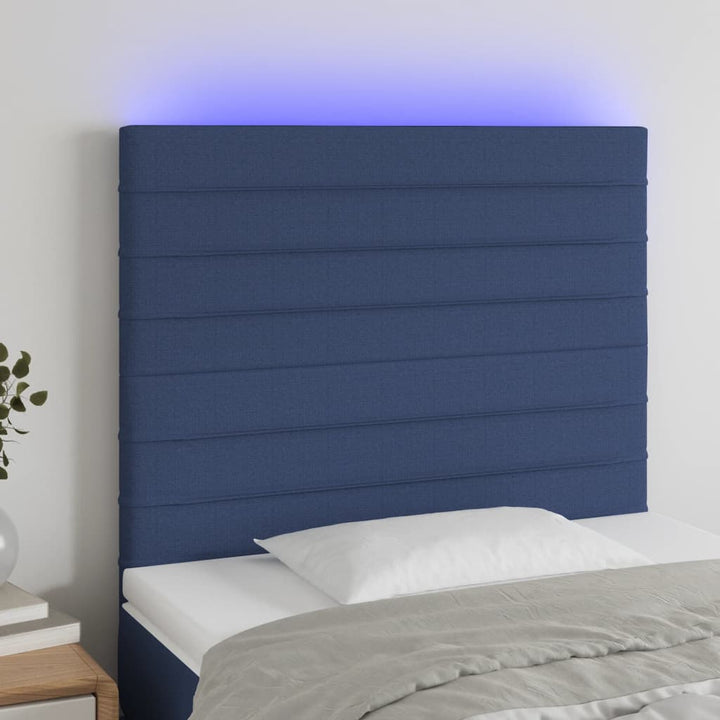 sengegavl med LED-lys 90x5x118/128 cm stof blå