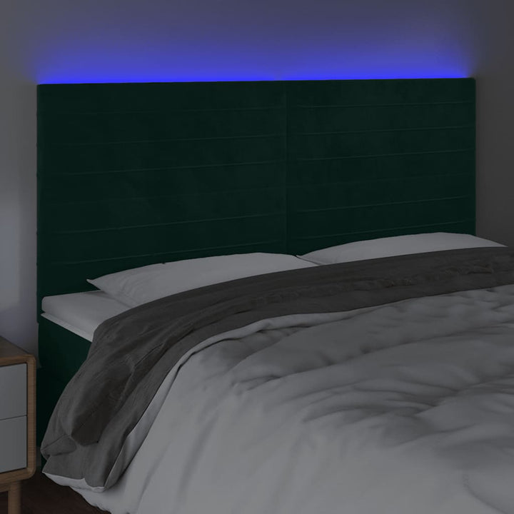 sengegavl med LED-lys 160x5x118/128 cm fløjl mørkegrøn