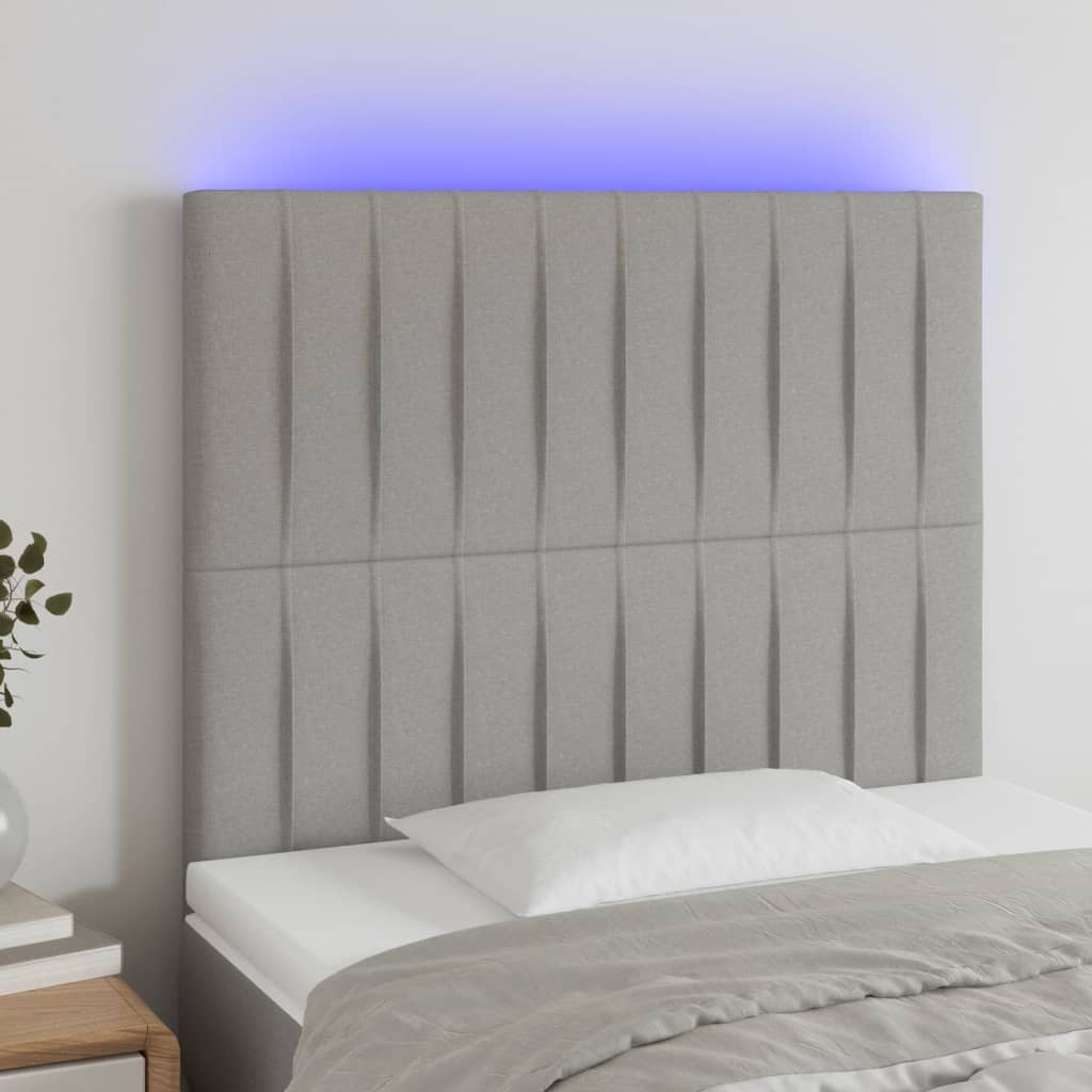 sengegavl med LED-lys 90x5x118/128 cm stof lysegrå