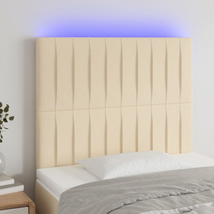 sengegavl med LED-lys 100x5x118/128 cm stof cremefarvet