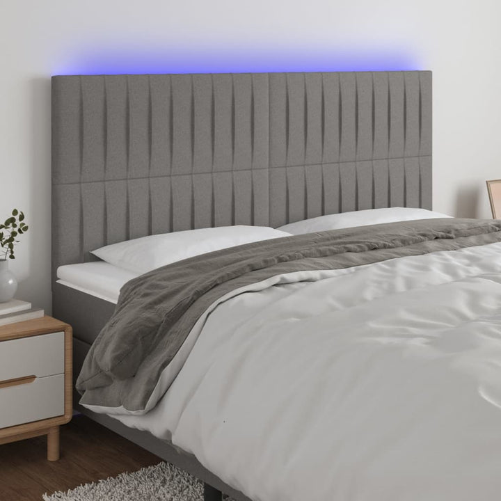 sengegavl med LED-lys 180x5x118/128 cm stof mørkegrå
