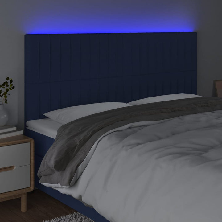sengegavl med LED-lys 180x5x118/128 cm stof blå