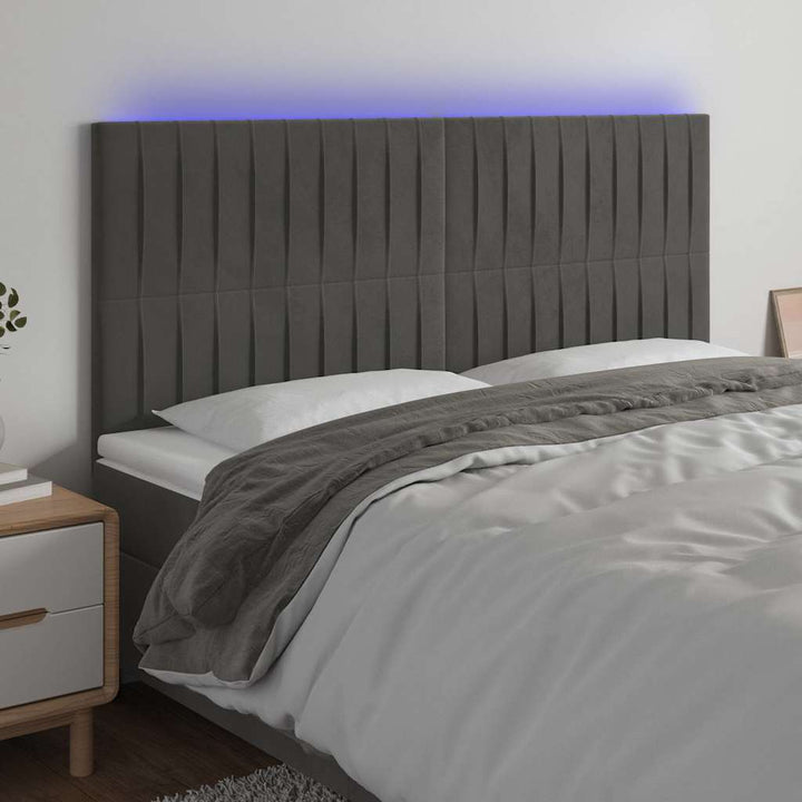 sengegavl med LED-lys 160x5x118/128 cm fløjl mørkegrå