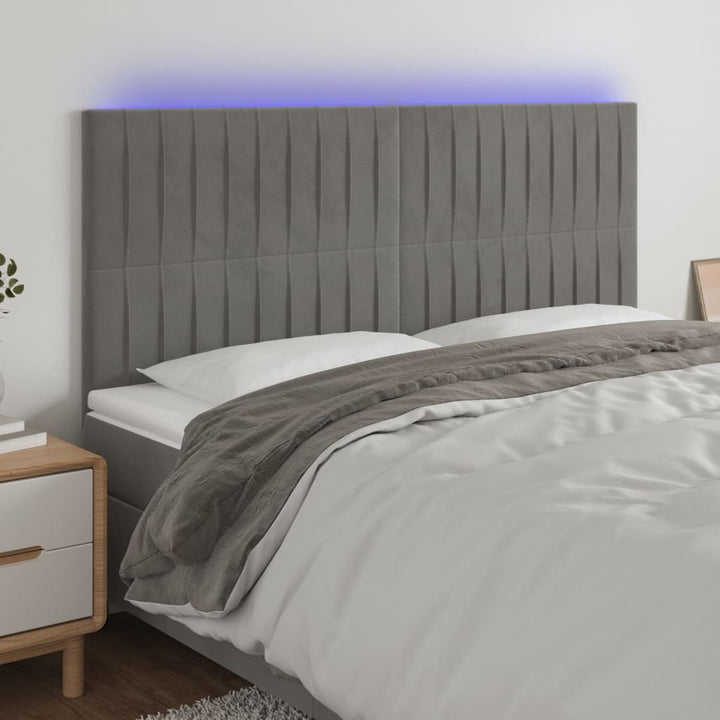sengegavl med LED-lys 180x5x118/128 cm fløjl lysegrå