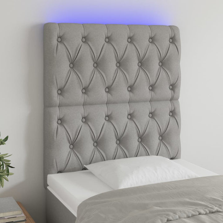 sengegavl med LED-lys 80x7x118/128 cm stof lysegrå