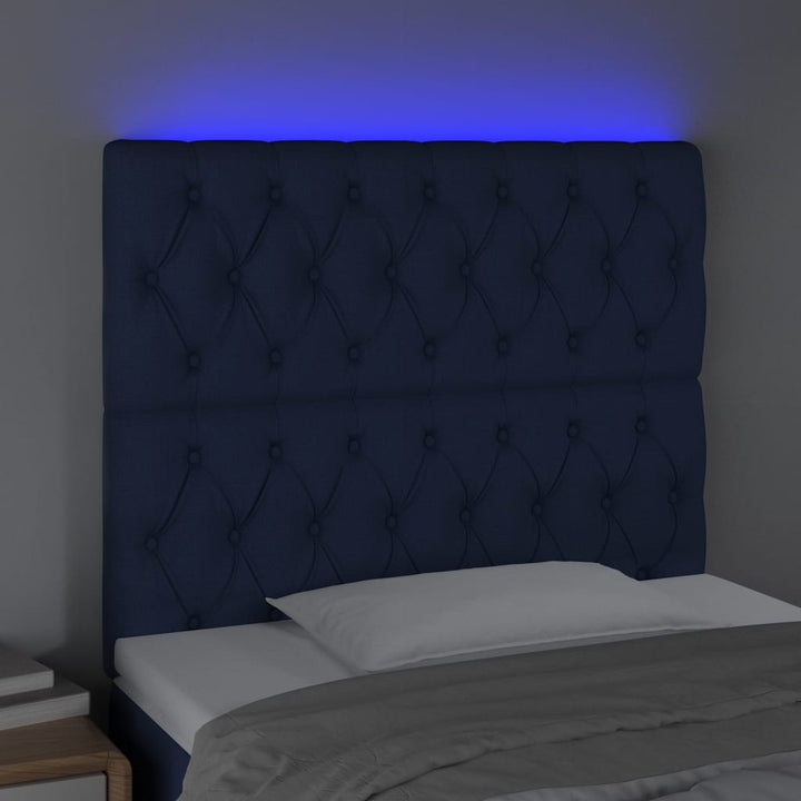 sengegavl med LED-lys 90x7x118/128 cm stof blå