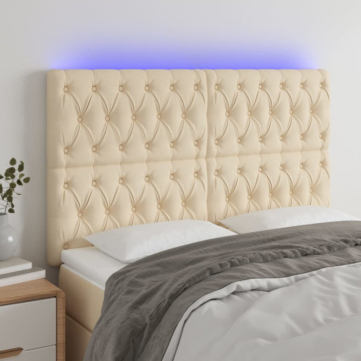 sengegavl med LED-lys 160x7x118/128 cm stof cremefarvet