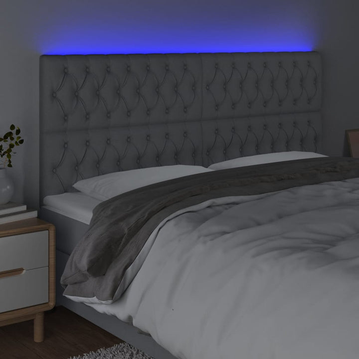 sengegavl med LED-lys 200x7x118/128 cm stof lysegrå