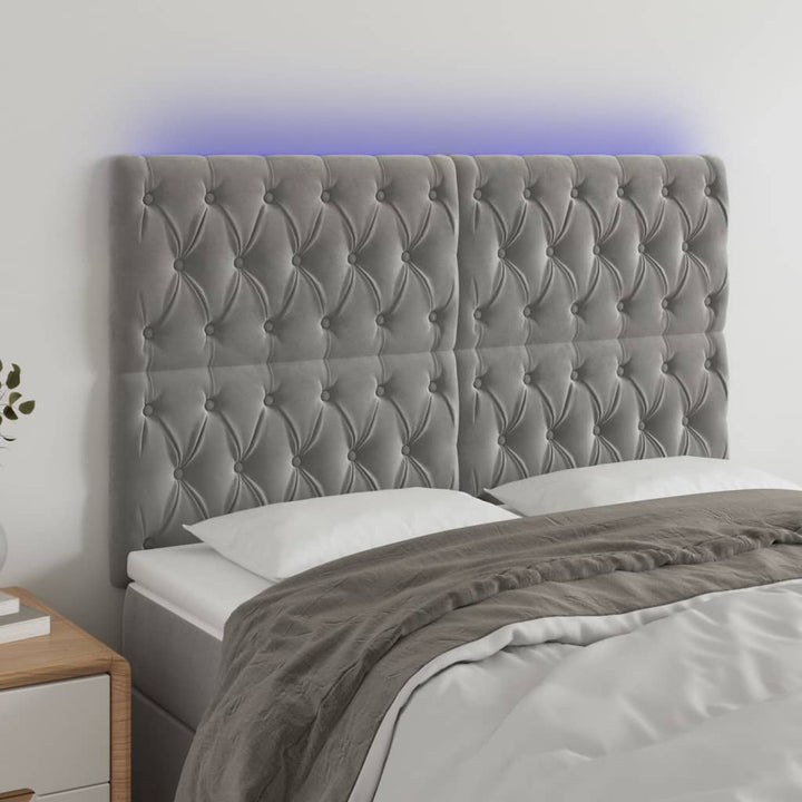 sengegavl med LED-lys 144x7x118/128 cm fløjl lysegrå