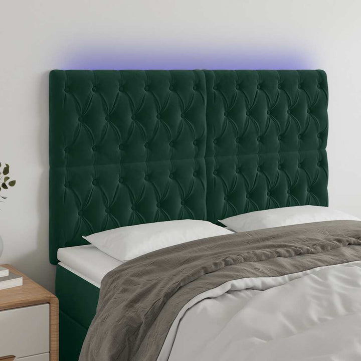 sengegavl med LED-lys 160x7x118/128 cm fløjl mørkegrøn