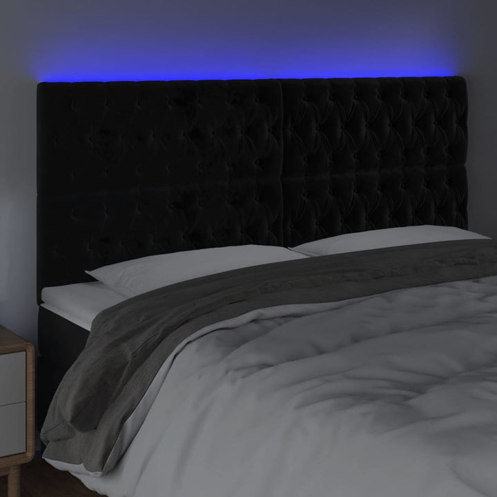 sengegavl med LED-lys 180x7x118/128 cm fløjl sort
