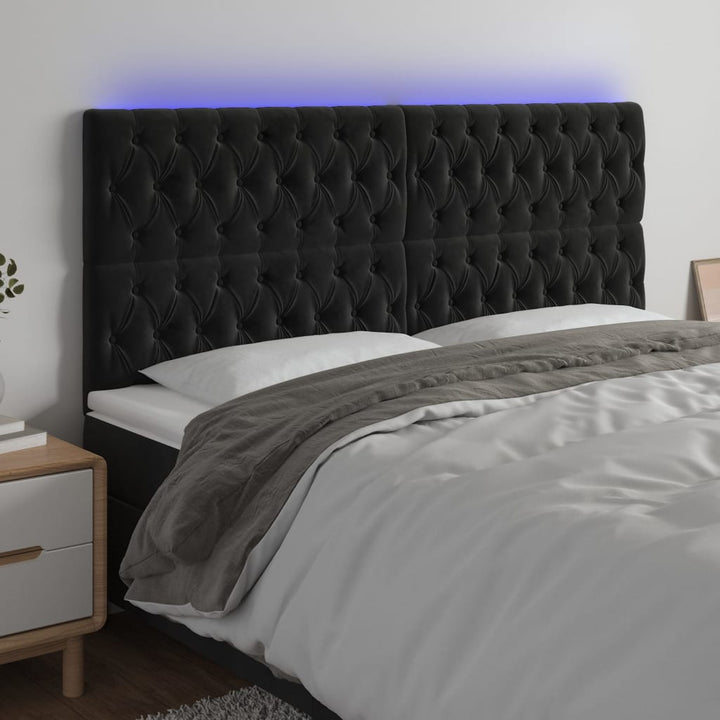 sengegavl med LED-lys 200x7x118/128 cm fløjl sort