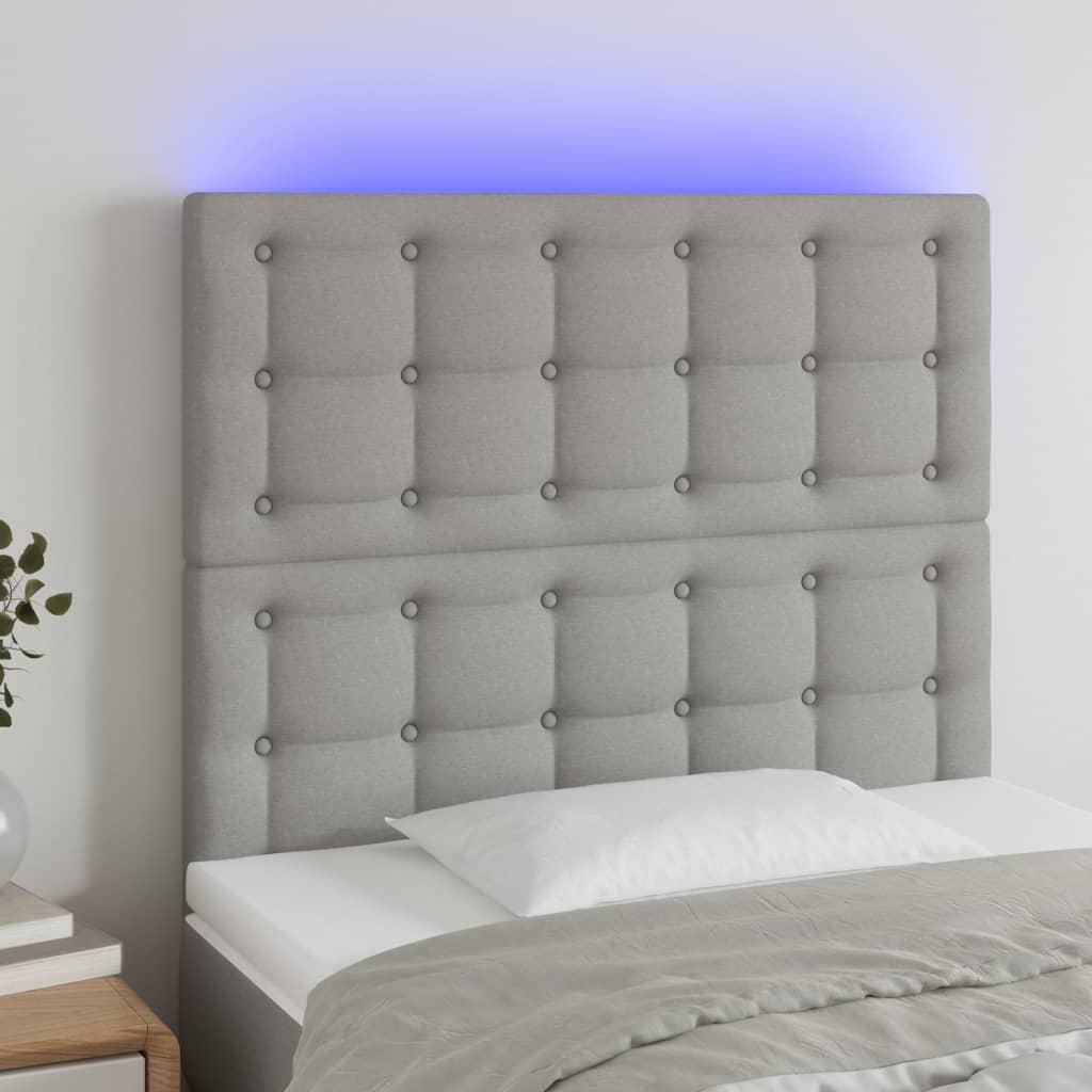 sengegavl med LED-lys 100x5x118/128 cm stof lysegrå
