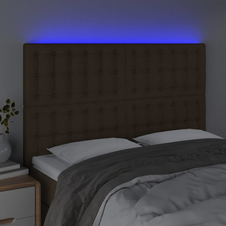 sengegavl med LED-lys 144x5x118/128 cm stof mørkebrun