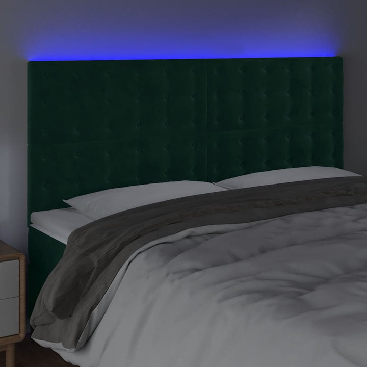 sengegavl med LED-lys 160x5x118/128 cm fløjl mørkegrøn