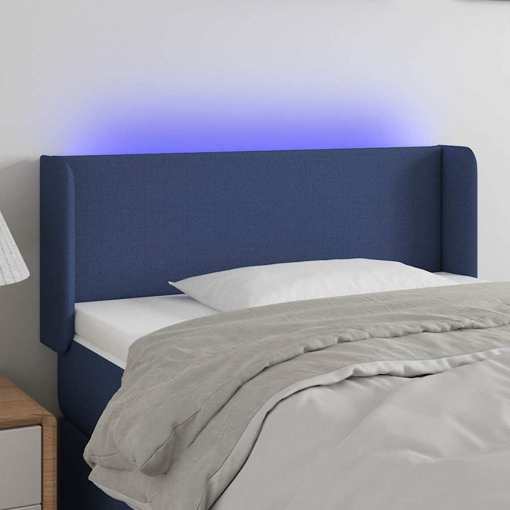 sengegavl med LED-lys 93x16x78/88 cm stof blå