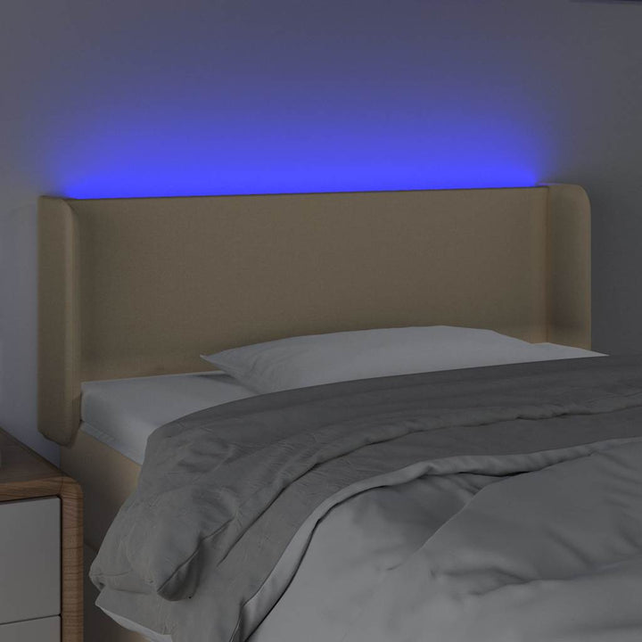 sengegavl med LED-lys 103x16x78/88 cm stof cremefarvet