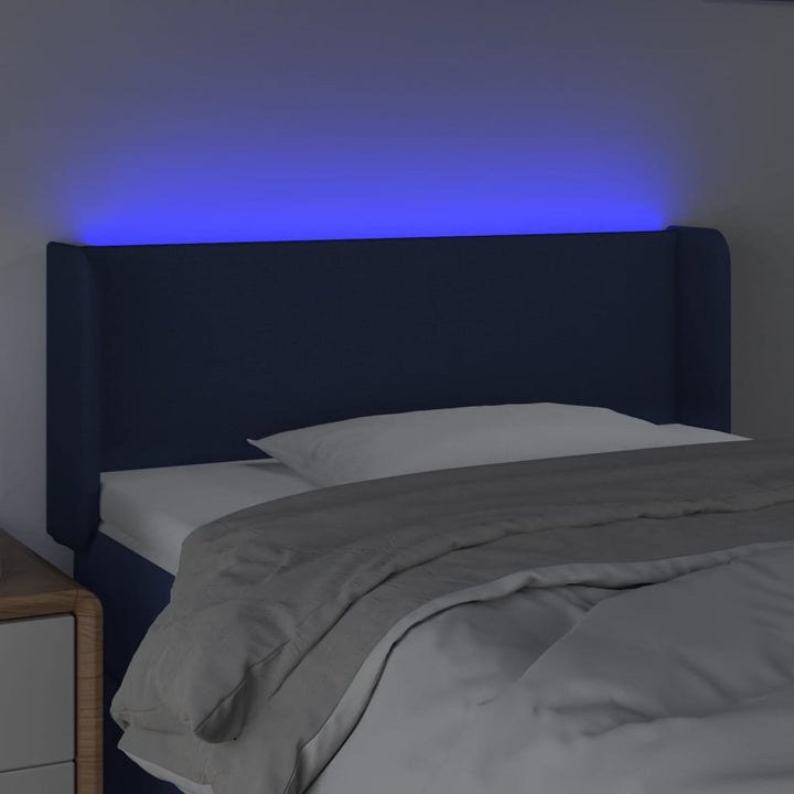 sengegavl med LED-lys 103x16x78/88 cm stof blå