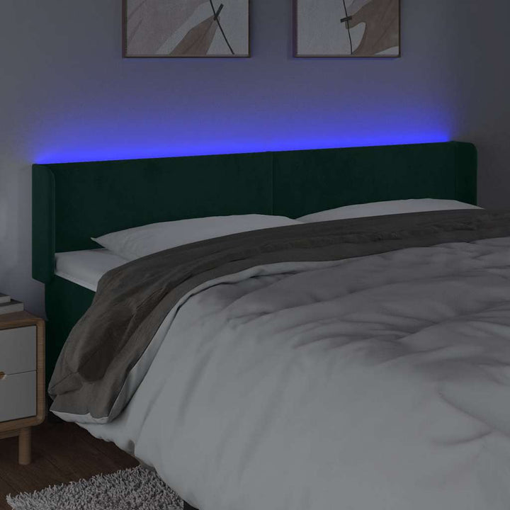sengegavl med LED-lys 203x16x78/88 cm fløjl mørkegrøn