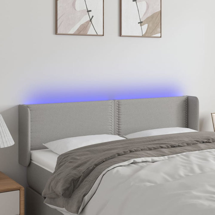 sengegavl med LED-lys 147x16x78/88 cm stof lysegrå