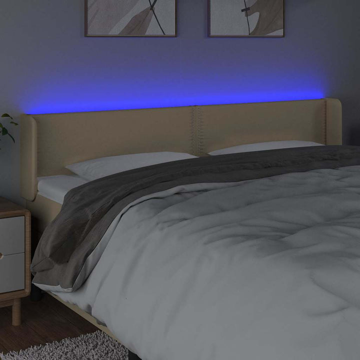 sengegavl med LED-lys 203x16x78/88 cm stof cremefarvet
