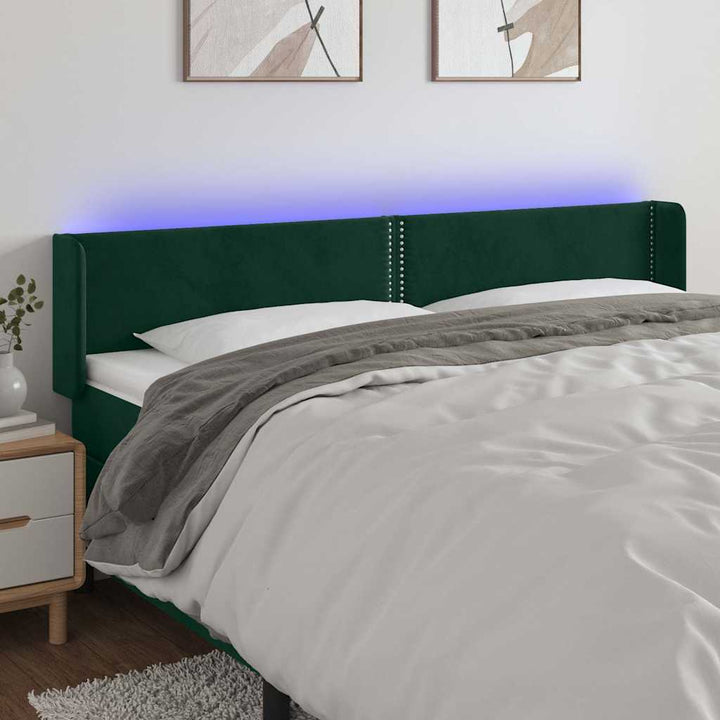 sengegavl med LED-lys 203x16x78/88 cm fløjl mørkegrøn