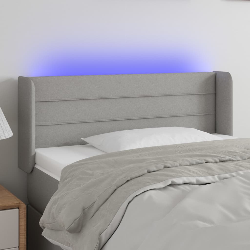 sengegavl med LED-lys 103x16x78/88 cm stof lysegrå