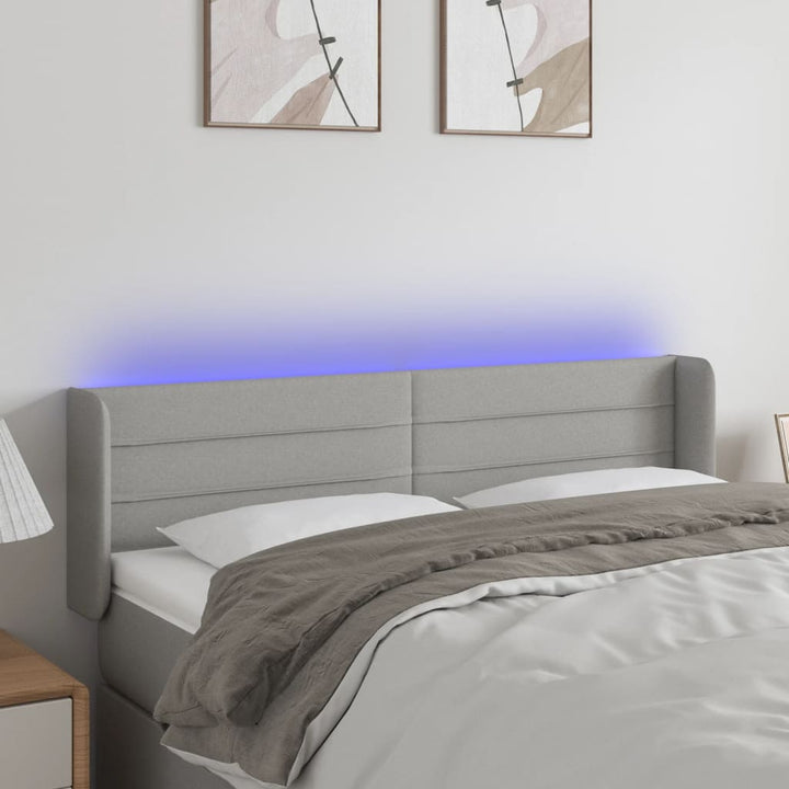 sengegavl med LED-lys 147x16x78/88 cm stof lysegrå
