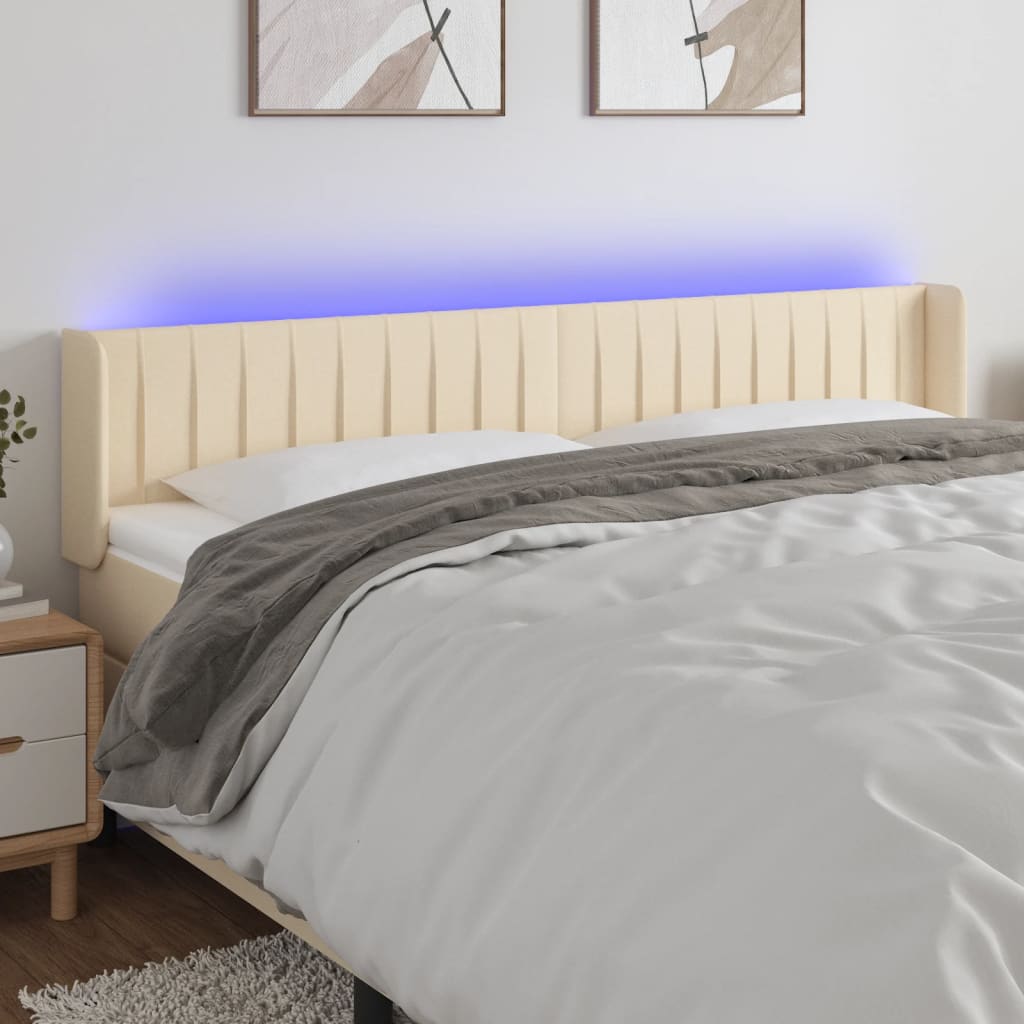 sengegavl med LED-lys 183x16x78/88 cm stof cremefarvet