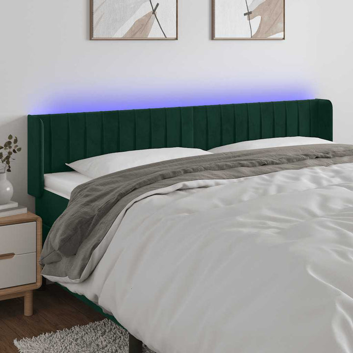 sengegavl med LED-lys 163x16x78/88 cm fløjl mørkegrøn